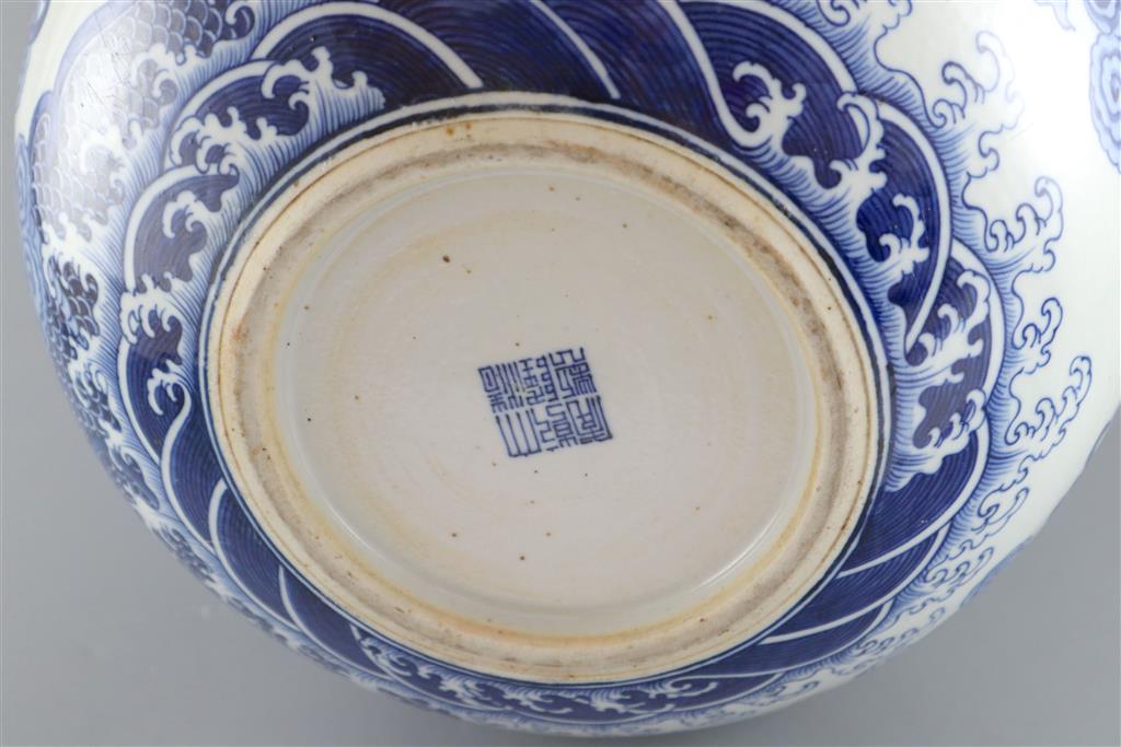 A large Chinese dragon bottle vase, Qianlong seal mark, probably late 19th century, 47cm high, wood stand